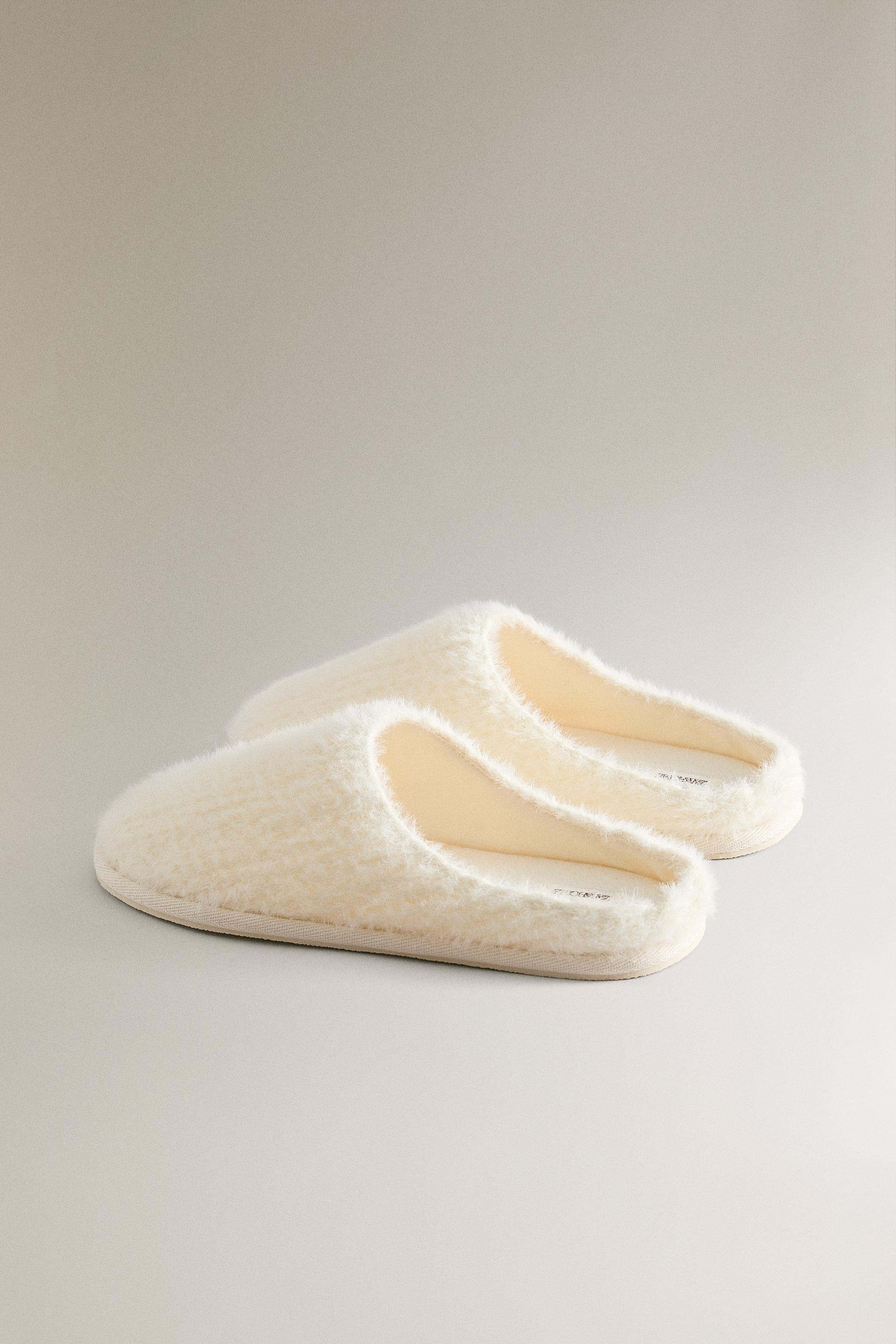 SLIPPERS WITH BRAIDED FAUX FUR DETAIL